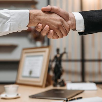 lawyer and client handshake agreement